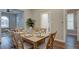 Dining room with wooden table, decor, and abundant natural light at 124 Elati St, Denver, CO 80223