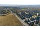 Aerial view of neighborhood and farmland at 13942 Jackson St, Thornton, CO 80602