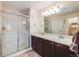 Bathroom boasts double sinks and a large walk-in shower at 13942 Jackson St, Thornton, CO 80602