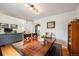 Dining area with wooden table, chairs, and hardwood floors at 13942 Jackson St, Thornton, CO 80602