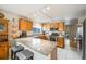 Kitchen boasts granite countertops and a breakfast bar with seating at 13942 Jackson St, Thornton, CO 80602