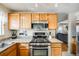 Kitchen with stainless steel appliances and granite countertops at 13942 Jackson St, Thornton, CO 80602