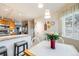 Kitchen features a breakfast bar and granite countertops at 13942 Jackson St, Thornton, CO 80602