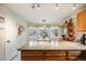 Kitchen features a breakfast nook with bay windows and granite counters at 13942 Jackson St, Thornton, CO 80602