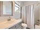Bright bathroom with a single sink vanity, tiled backsplash, and a shower-tub combination at 7866 Witney Pl, Lone Tree, CO 80124