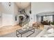 Bright foyer featuring a curved staircase, high ceilings, and an open flow to the dining room at 7866 Witney Pl, Lone Tree, CO 80124