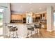 Spacious kitchen boasting granite counters, stainless appliances, breakfast bar and a seamless design for entertaining at 7866 Witney Pl, Lone Tree, CO 80124
