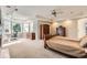 Spacious main bedroom features a bay window, ceiling fan, and ample closet space for comfortable living at 7866 Witney Pl, Lone Tree, CO 80124