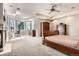 Spacious main bedroom with large bay windows, fireplace, and vintage furniture at 7866 Witney Pl, Lone Tree, CO 80124
