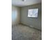 Bedroom with a window, neutral walls, and carpeted floors at 7331 Utica St, Westminster, CO 80030
