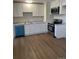 Modern kitchen features white cabinetry, stainless steel appliances, and granite countertops, ideal for cooking at 7331 Utica St, Westminster, CO 80030
