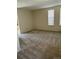 Living room featuring carpeted floors, and multiple windows at 7331 Utica St, Westminster, CO 80030