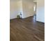 Spacious living room with wood floors, freshly painted walls, and ample natural light at 7331 Utica St, Westminster, CO 80030