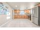 Bright kitchen with wood cabinets and stainless steel appliances at 1250 S Tennyson St, Denver, CO 80219