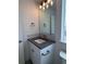 Updated powder room vanity with countertop, mirror and fixtures at 14223 Currant St, Broomfield, CO 80020