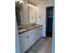 Modern bathroom featuring a double vanity with stone countertop and stylish fixtures at 14223 Currant St, Broomfield, CO 80020