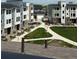 Desirable neighborhood showcasing modern townhomes, a walking path, and well maintained green spaces at 14223 Currant St, Broomfield, CO 80020