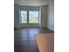 Spacious living room featuring hardwood floors and plenty of natural light from large windows at 14223 Currant St, Broomfield, CO 80020