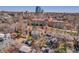 An aerial shot showcases neighborhood homes, a red arrow identifies this property, and downtown buildings are visible in the distance at 161 S Pearl St, Denver, CO 80209