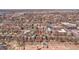 A bird's eye view showcases the neighborhood, mature trees, and a red arrow pointing to this cozy, centrally located home at 161 S Pearl St, Denver, CO 80209