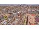 An aerial shot shows a residential area with downtown buildings in the distance, and a red arrow identifies this property at 161 S Pearl St, Denver, CO 80209