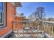 Outdoor balcony featuring wooden furniture with a view at 161 S Pearl St, Denver, CO 80209