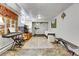 Finished basement with a large area rug, exercise equipment, and tapestry at 161 S Pearl St, Denver, CO 80209