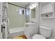 Updated bathroom featuring subway tile, white vanity, and modern fixtures at 161 S Pearl St, Denver, CO 80209