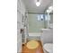 Updated bathroom featuring subway tile, white vanity, and modern fixtures at 161 S Pearl St, Denver, CO 80209
