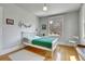 Bedroom with a large window and hardwood floors at 161 S Pearl St, Denver, CO 80209