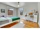 Cozy bedroom with hardwood floors, white trim, and a desk by the window at 161 S Pearl St, Denver, CO 80209