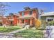 Charming brick two story house with a well-manicured lawn and inviting front porch at 161 S Pearl St, Denver, CO 80209