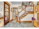 Inviting foyer with hardwood floors, a classic staircase, and beautiful wood trim at 161 S Pearl St, Denver, CO 80209