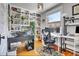 Bright home office with hardwood floors, built-in bookshelves and a large window with natural light at 161 S Pearl St, Denver, CO 80209