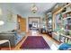 Bright living room featuring beautiful built-in bookshelves and hardwood floors at 161 S Pearl St, Denver, CO 80209