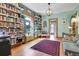 Bright living room featuring beautiful built-in bookshelves and hardwood floors at 161 S Pearl St, Denver, CO 80209