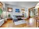 Cozy living room featuring hardwood floors, natural light, and comfortable seating at 161 S Pearl St, Denver, CO 80209