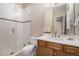 Bright bathroom featuring subway tiles, large walk-in shower, and modern vanity at 8440 Rush Creek Ave, Littleton, CO 80125