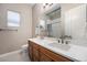 Bathroom featuring a double vanity with modern fixtures and great lighting at 8440 Rush Creek Ave, Littleton, CO 80125