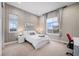 Cozy bedroom with neutral tones, two windows, and modern decor at 8440 Rush Creek Ave, Littleton, CO 80125