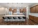 Gourmet kitchen with a large island, stainless steel appliances, and pendant lighting for a sleek design at 8440 Rush Creek Ave, Littleton, CO 80125