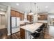 Well-appointed kitchen with a center island, stainless steel appliances, and a clean, modern aesthetic at 8440 Rush Creek Ave, Littleton, CO 80125