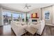 Bright living room with large windows, fireplace, and modern furnishings for comfortable living at 8440 Rush Creek Ave, Littleton, CO 80125