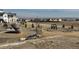 Community park featuring modern rock structures, landscaping, seating, and a walking path for recreation at 8440 Rush Creek Ave, Littleton, CO 80125
