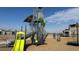 Large playground with slides, a climbing structure, and swings for children, offering a community recreational area at 8440 Rush Creek Ave, Littleton, CO 80125