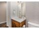 Charming powder room with patterned wallpaper, modern vanity, and stylish fixtures at 8440 Rush Creek Ave, Littleton, CO 80125