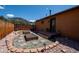 Cozy backyard featuring raised garden beds, stone steps, and a scenic mountain view at 351 N Saddle Dr, Idaho Springs, CO 80452