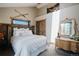 Bright bedroom featuring decorative skiis, wooden headboard and trim, and natural light at 351 N Saddle Dr, Idaho Springs, CO 80452