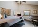 Bedroom with a queen-size bed, closet with rustic doors, and natural light from the window at 351 N Saddle Dr, Idaho Springs, CO 80452