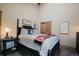 Comfortable bedroom with a queen size bed, rustic sliding closet door and decor at 351 N Saddle Dr, Idaho Springs, CO 80452